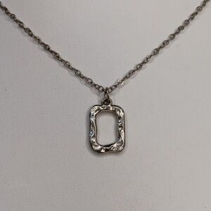 Hammered silver tone metal geometric frame necklace